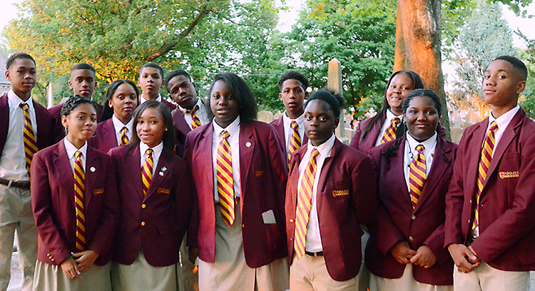ALL GROWN UP Our founding class began fifth grade on September 6, 2011, and grew in more ways than height. Here they pose at Baccalaureate Mass, their penultimate event at St. James School and the final time in their school uniforms.